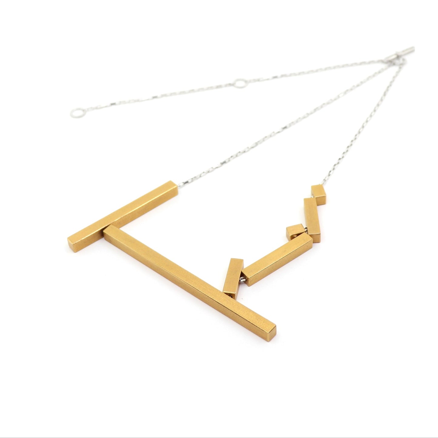 Gold necklace with geometric design on a white background
