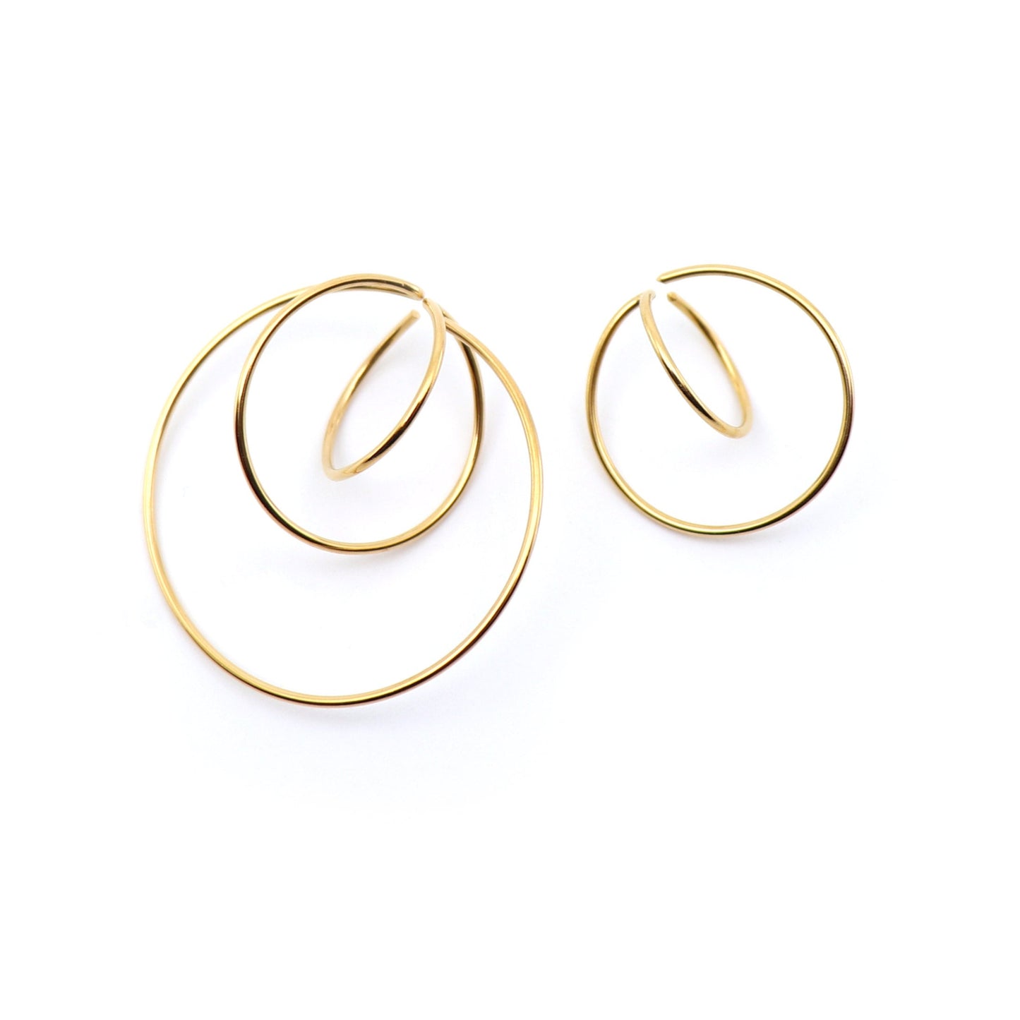 mismatched statement earrings in gold