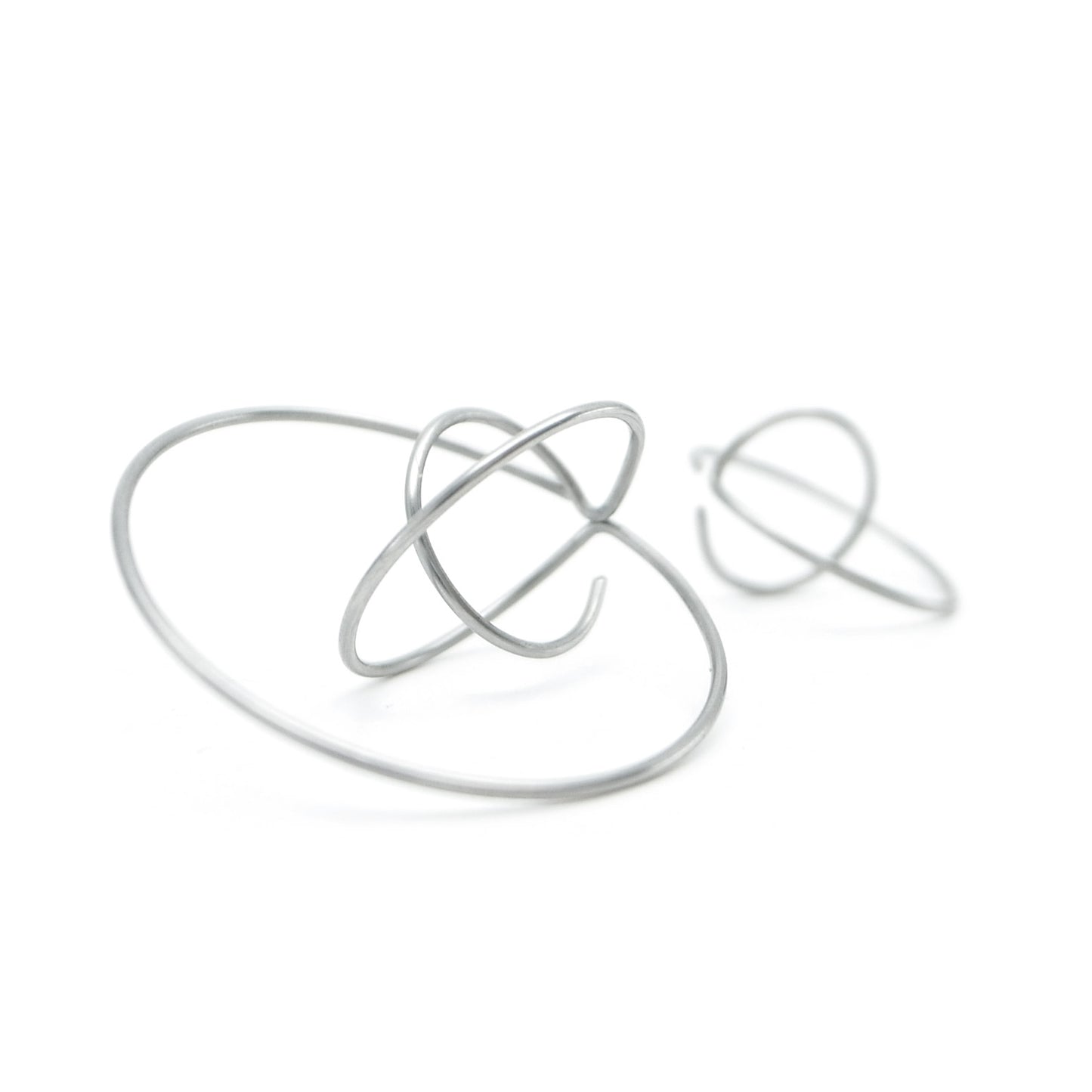 mismatched circular earrings