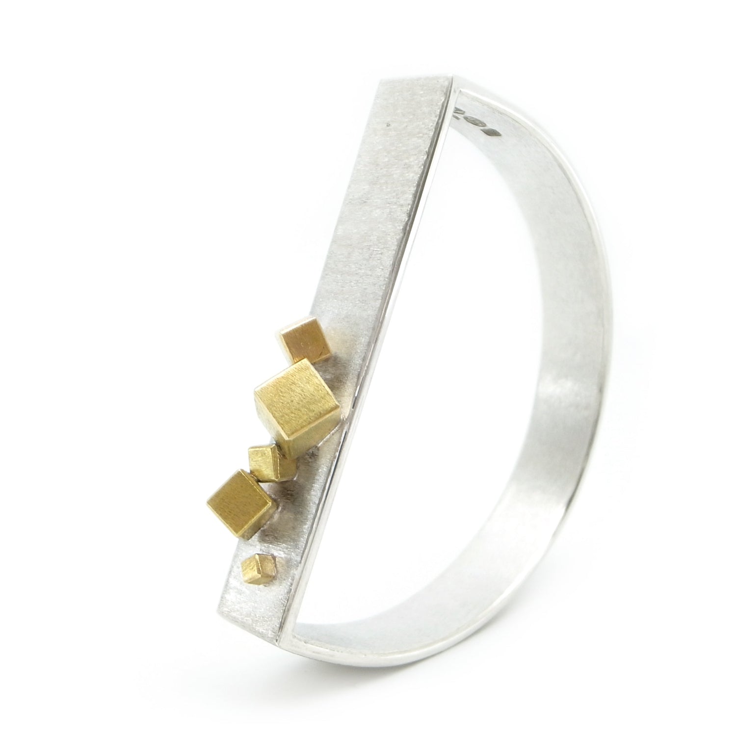 brutalist commissioned d-shaped bangle in silver