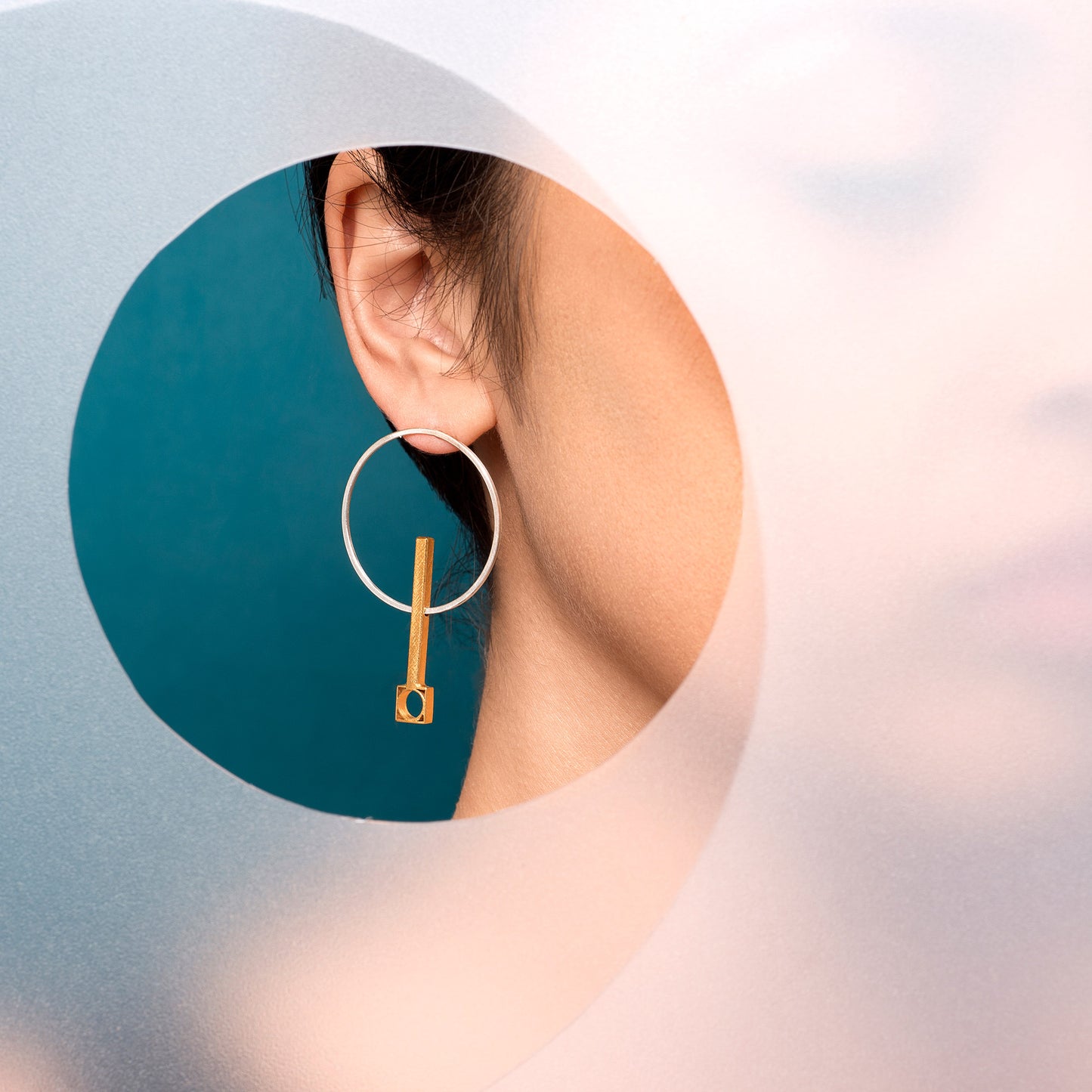 gold & silver earring on model
