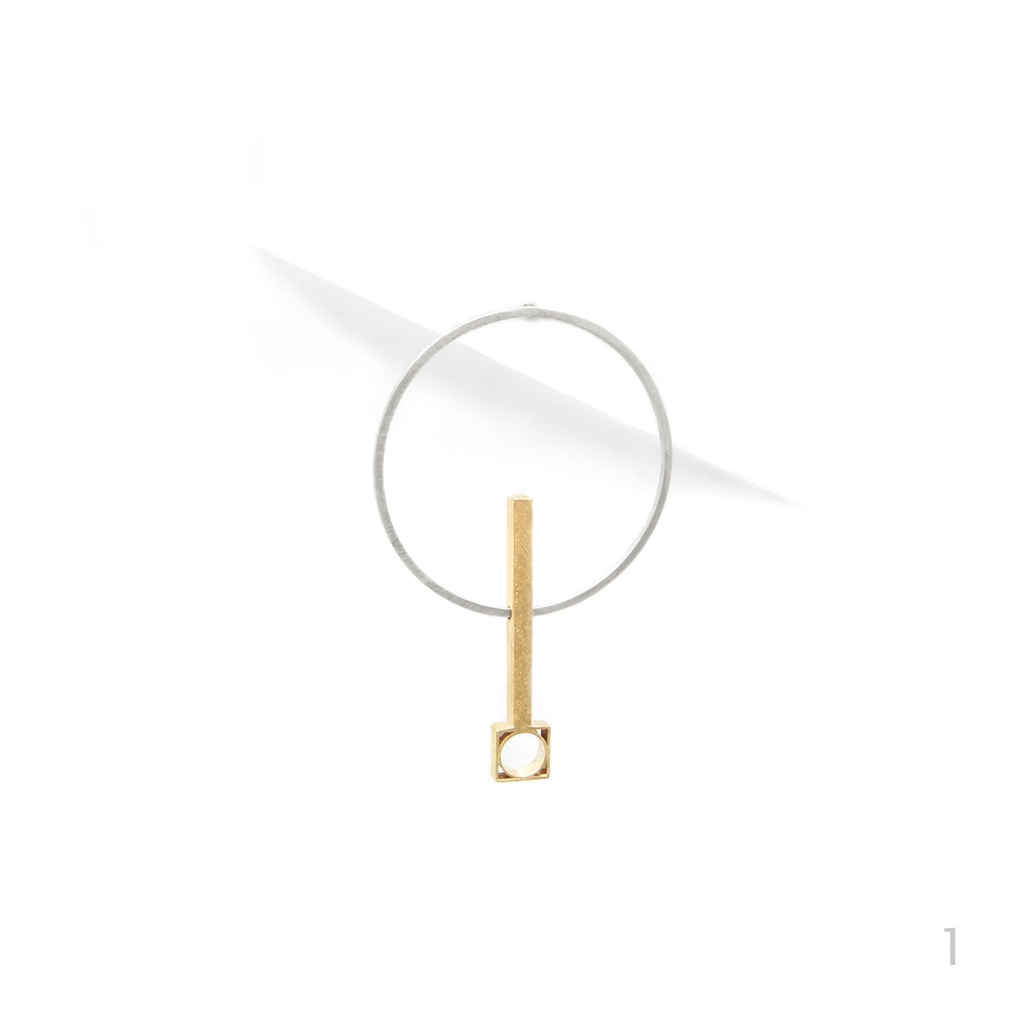 statement earring in gold and silver