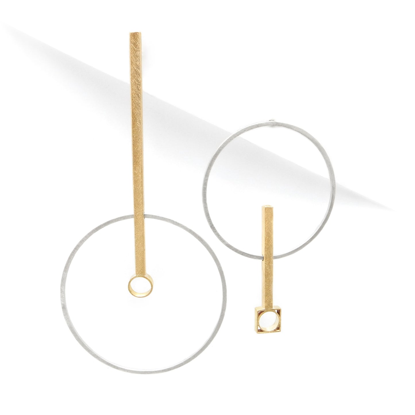 mismatched earrings in gold and silver