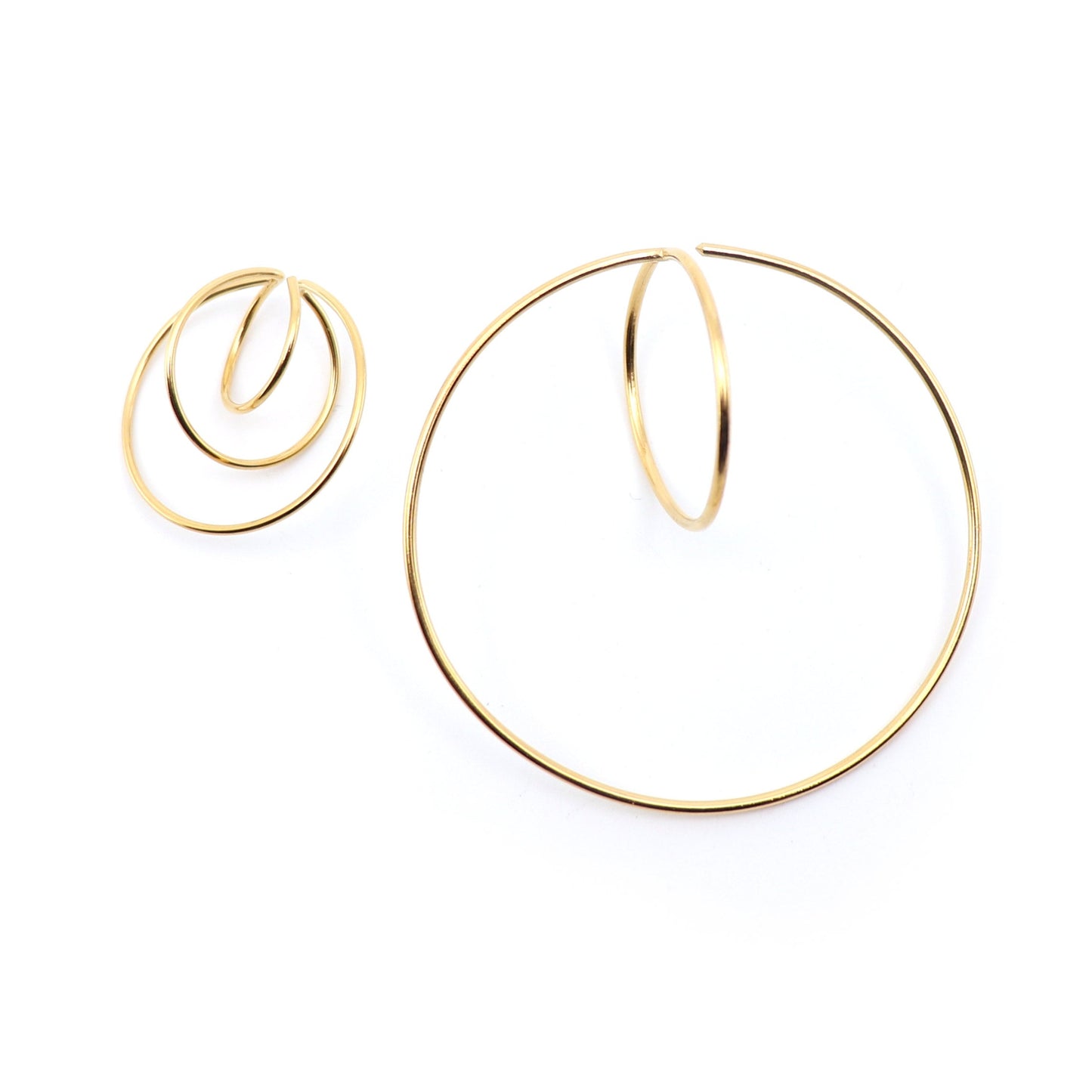 mismatched hoop statement earrings in gold