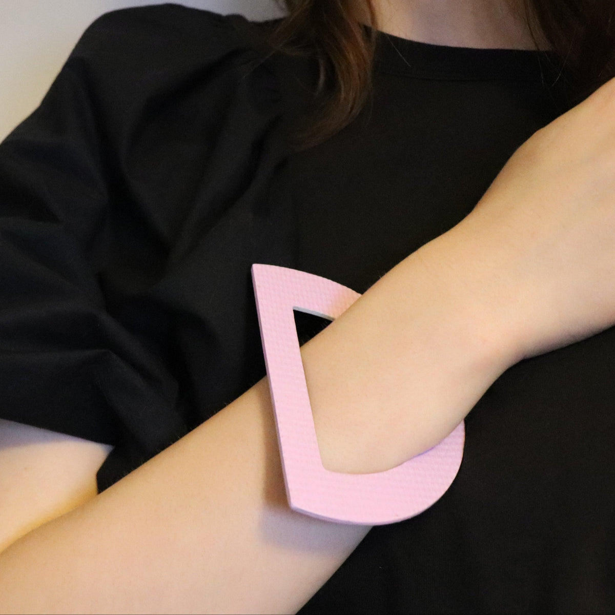 model wearing lilac statement bangle in linoleum