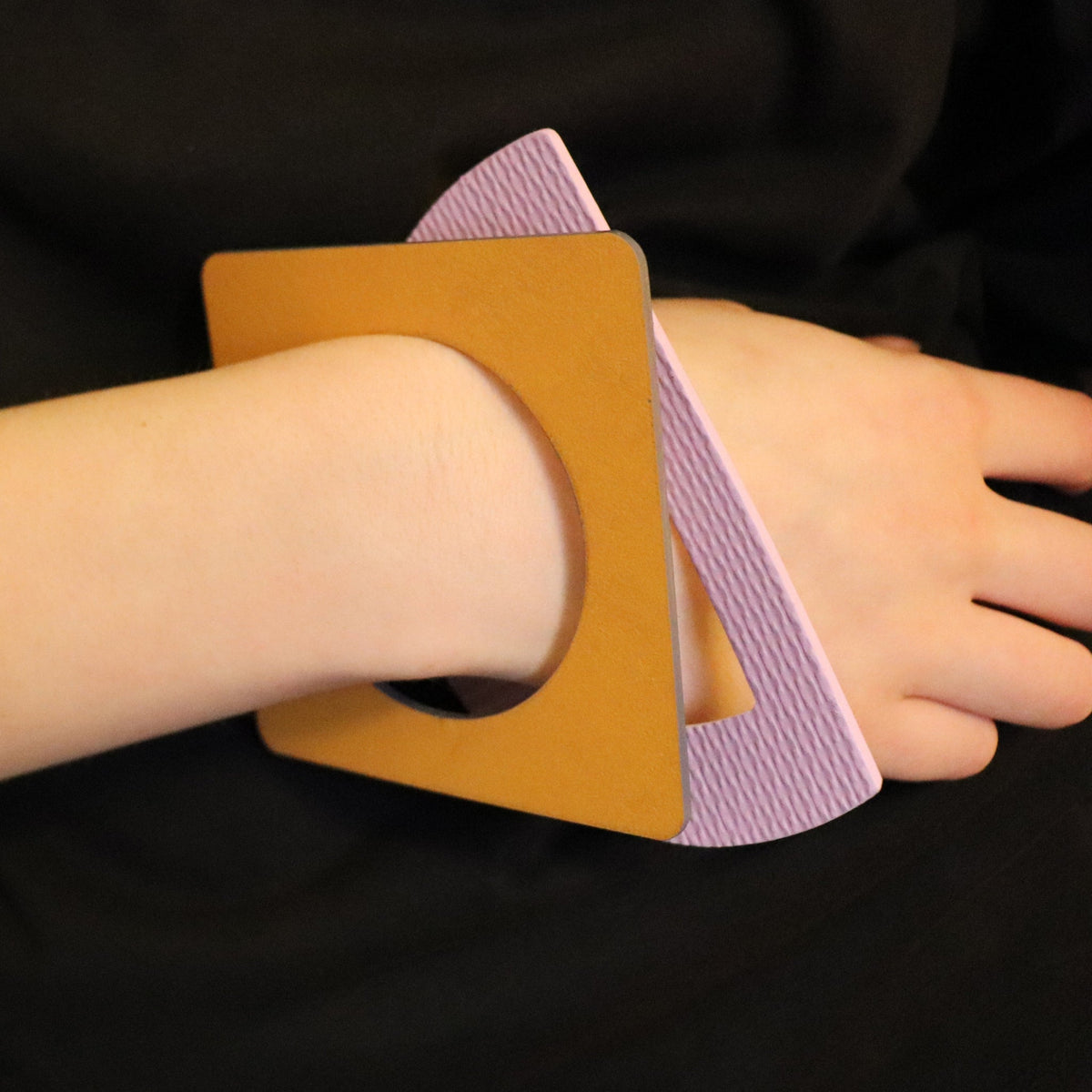 two linoleum bangles on wrist