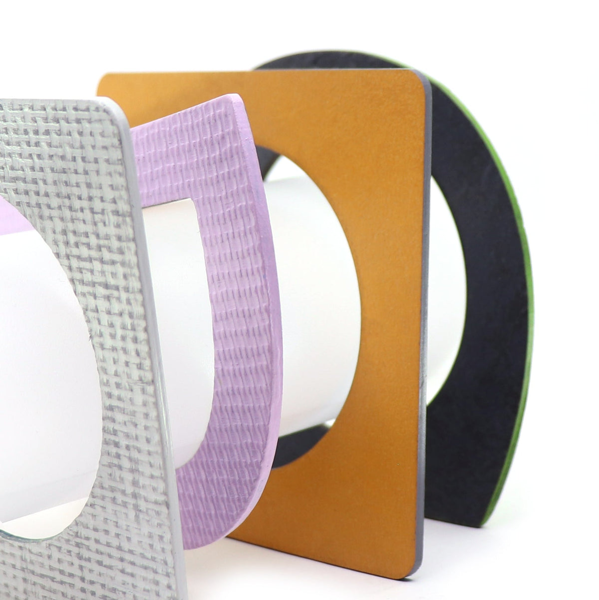 4 linoleum bangles in bauhaus style shapes