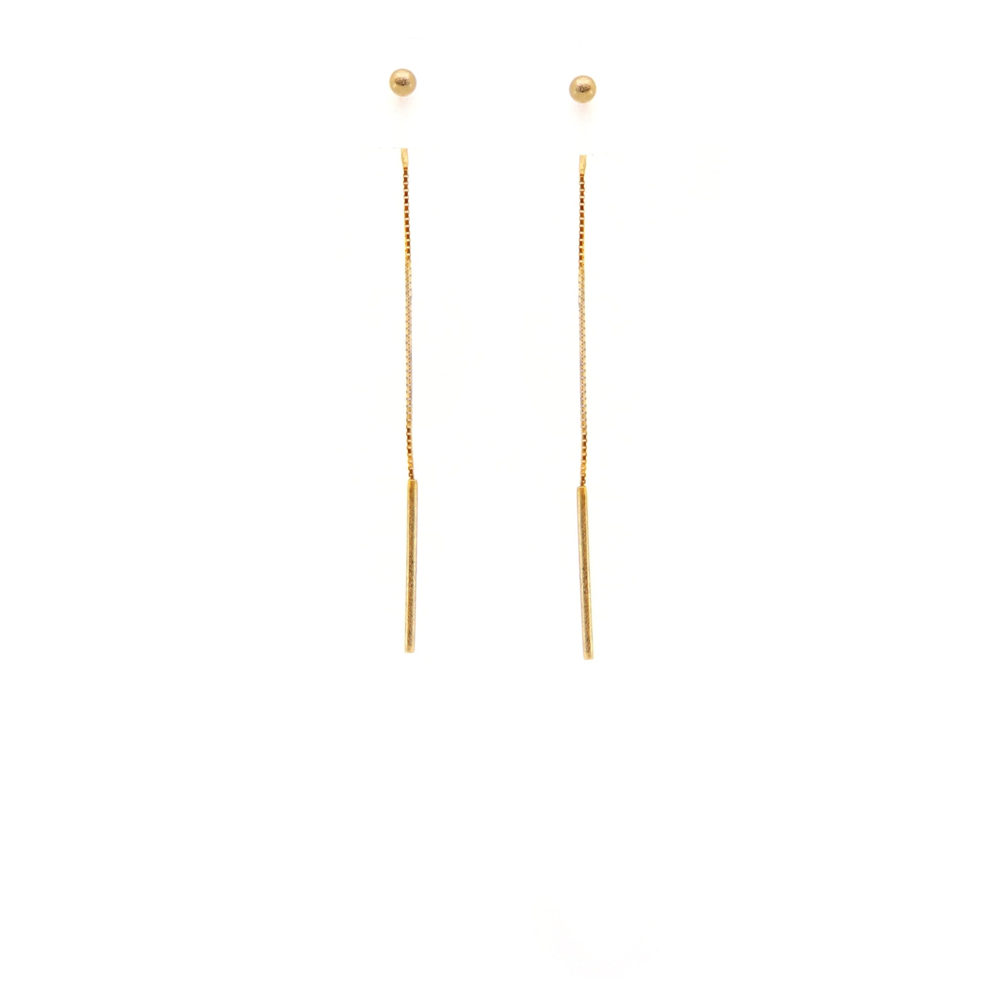 Gold ball threader earrings on a white background