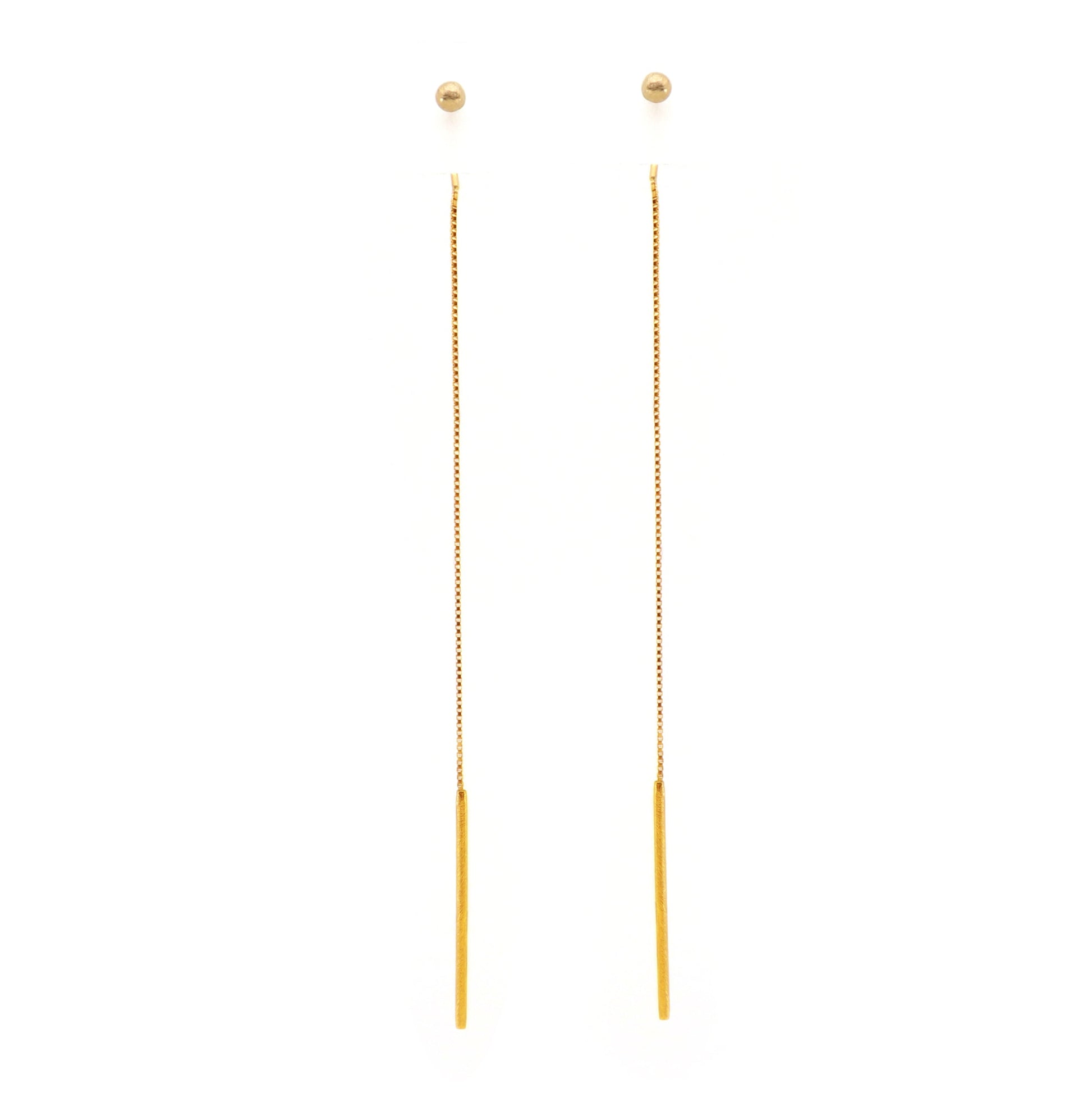 Gold ball threader earrings on a white background