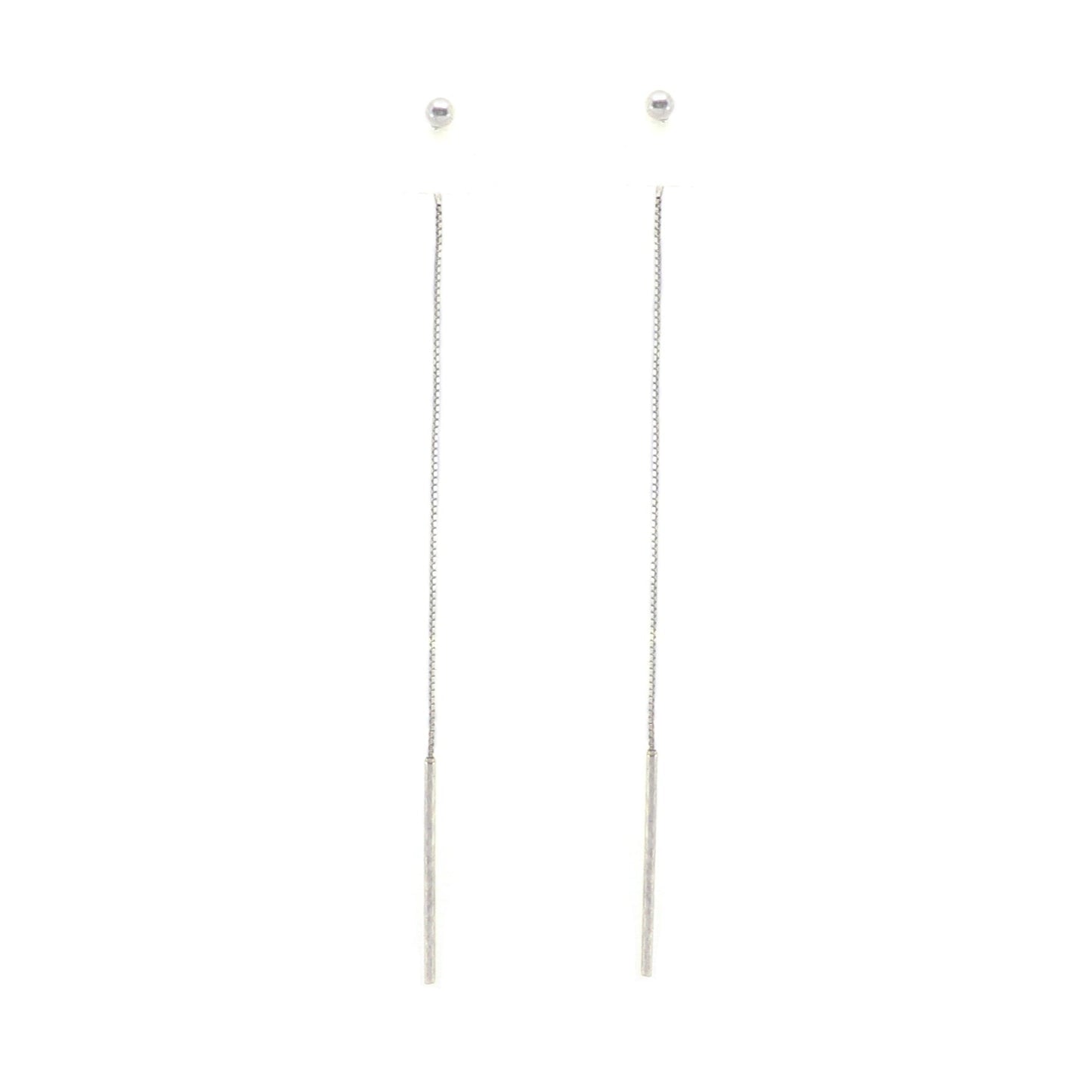 Pair of silver ball threaderearrings on a white background