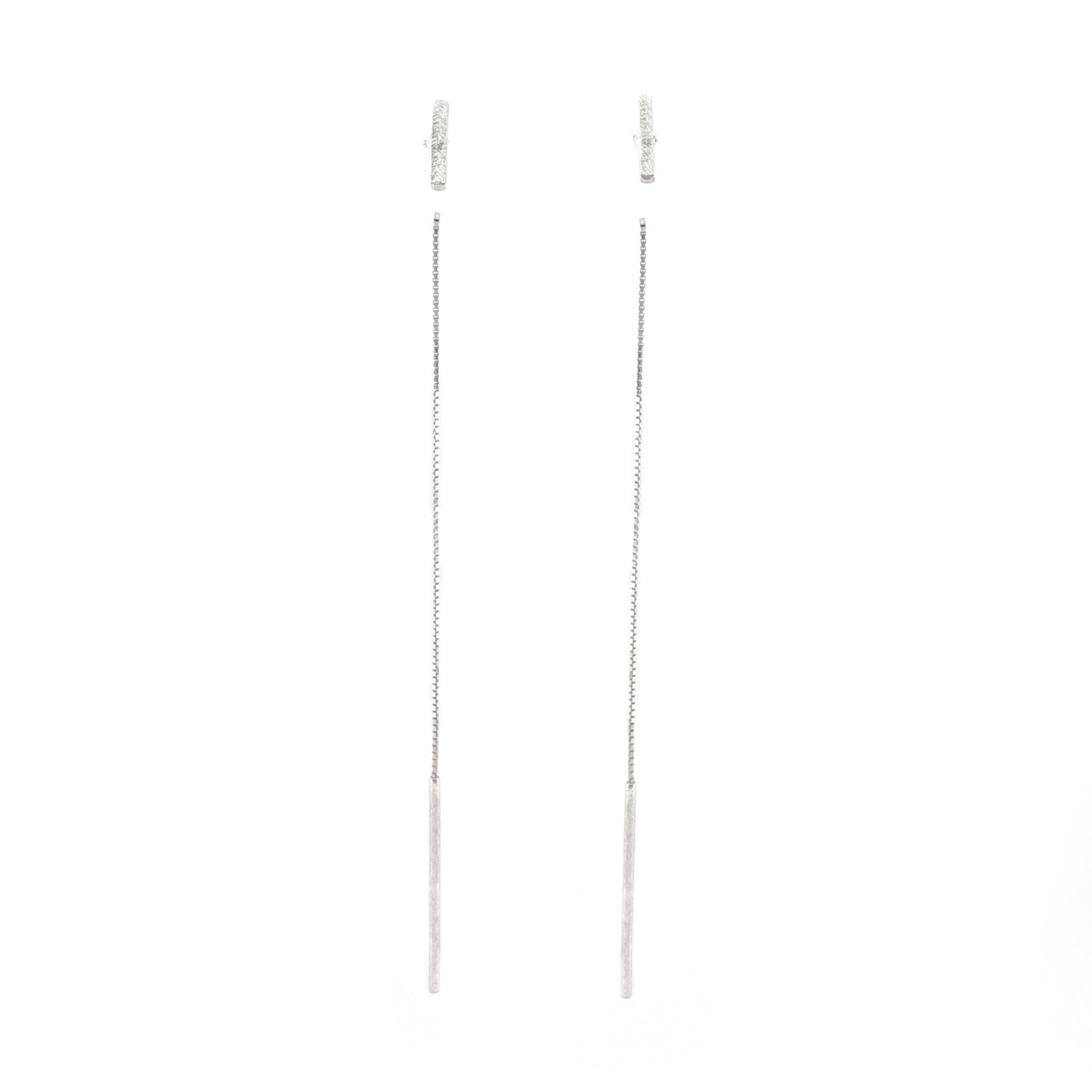 Pair of silver chain earrings on a white background