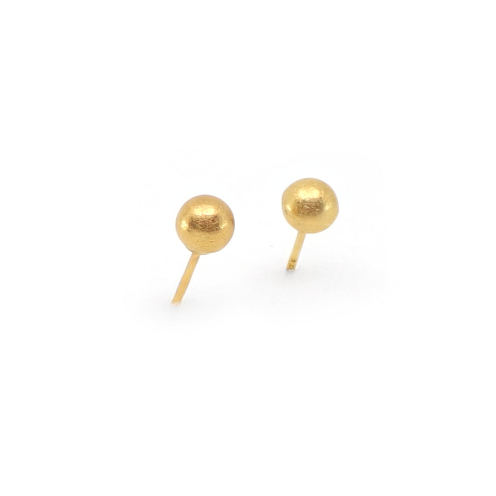 Pair of gold ball stud earrings on a white background