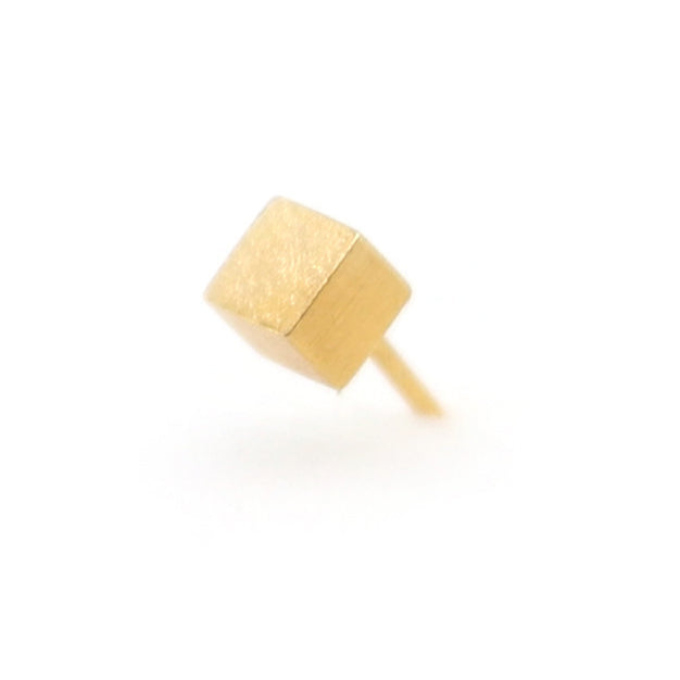 Gold earring on a white background