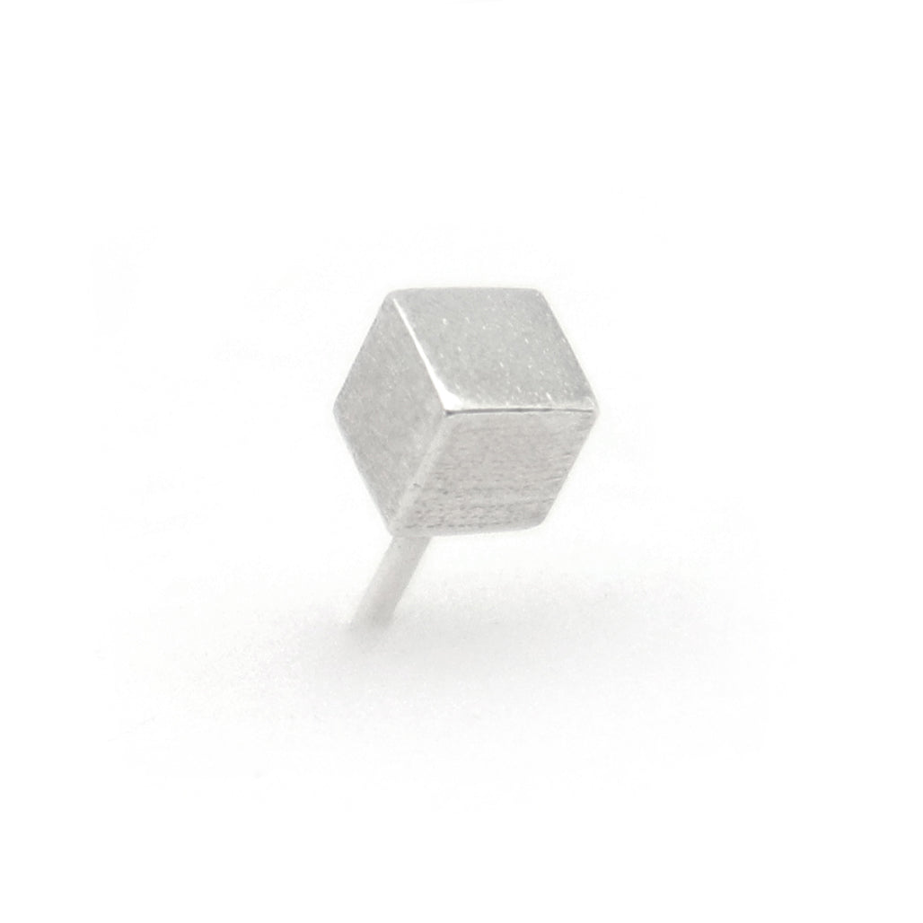 Silver cube stud earring on a white background