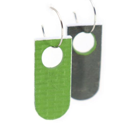 Green and gray earrings on a white background