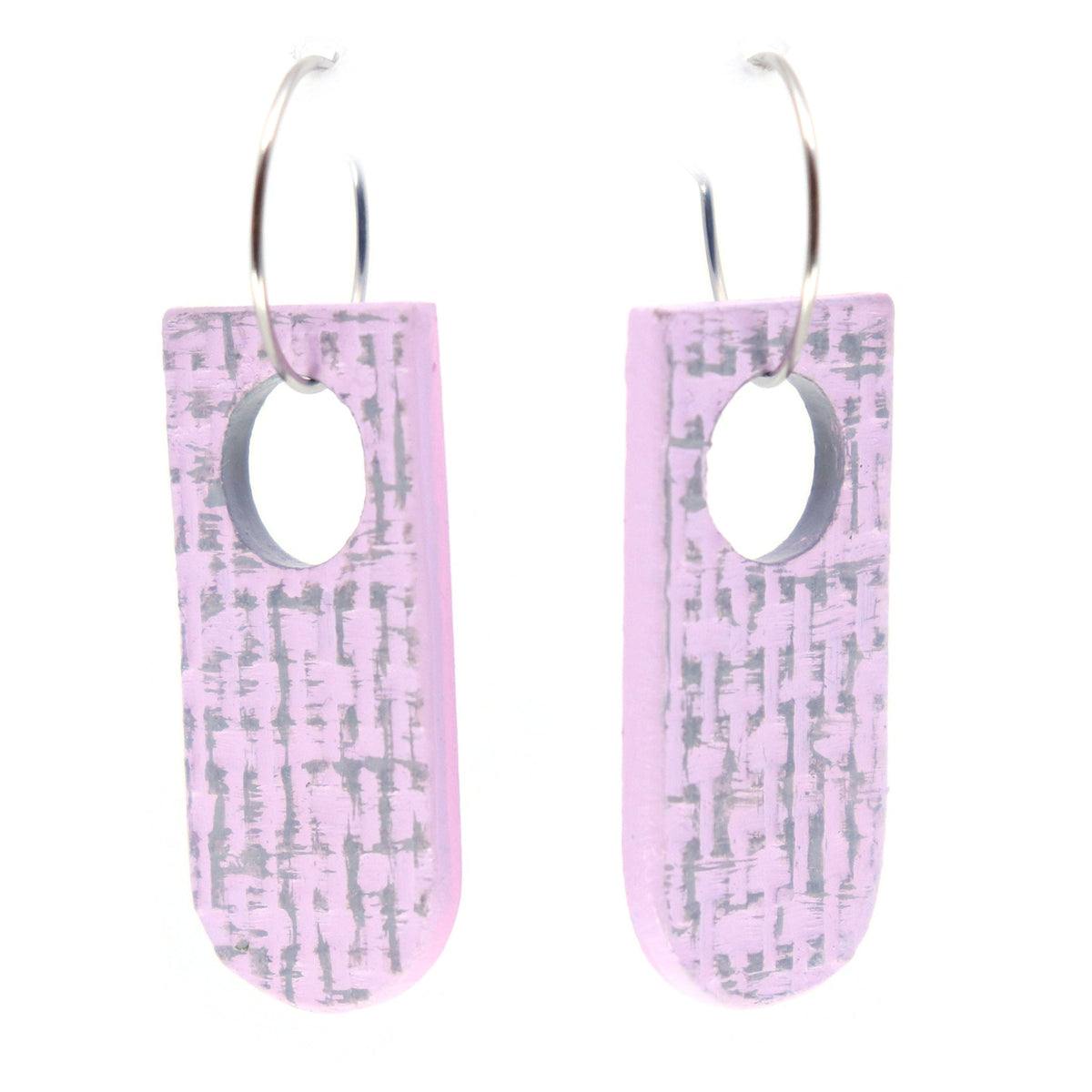 Pair of pink earrings with a subtle grey texture pattern on a white background