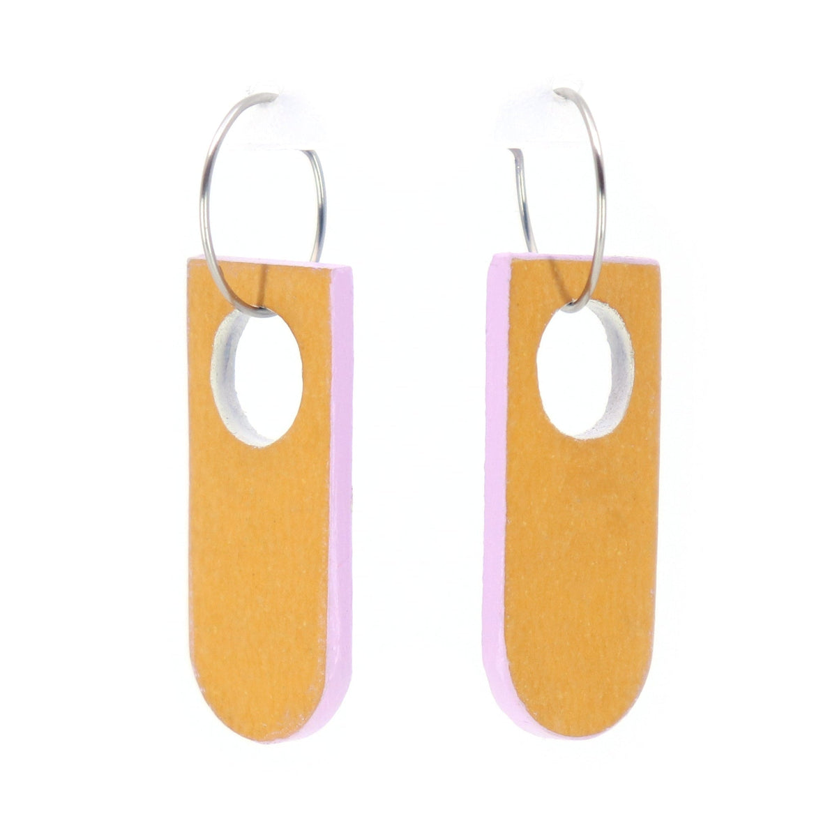 reversible linoleum earrings, the front is orange and the back is lilac