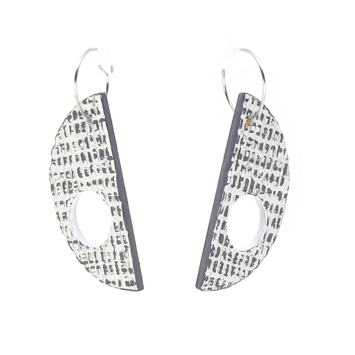 Pair of geometric earrings with textured design on a white background