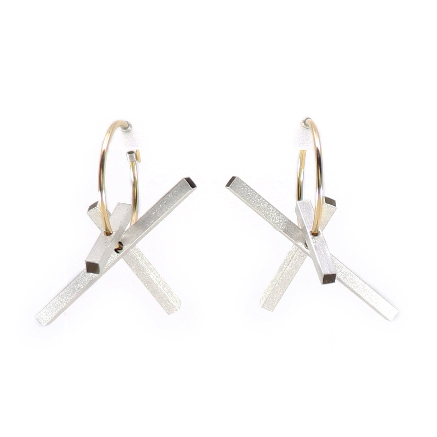 Pair of gold hoops earrings with silver rectangles on a white background