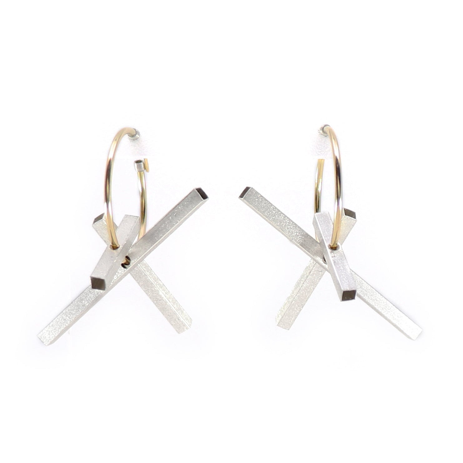 Pair of gold hoops earrings with silver rectangles on a white background