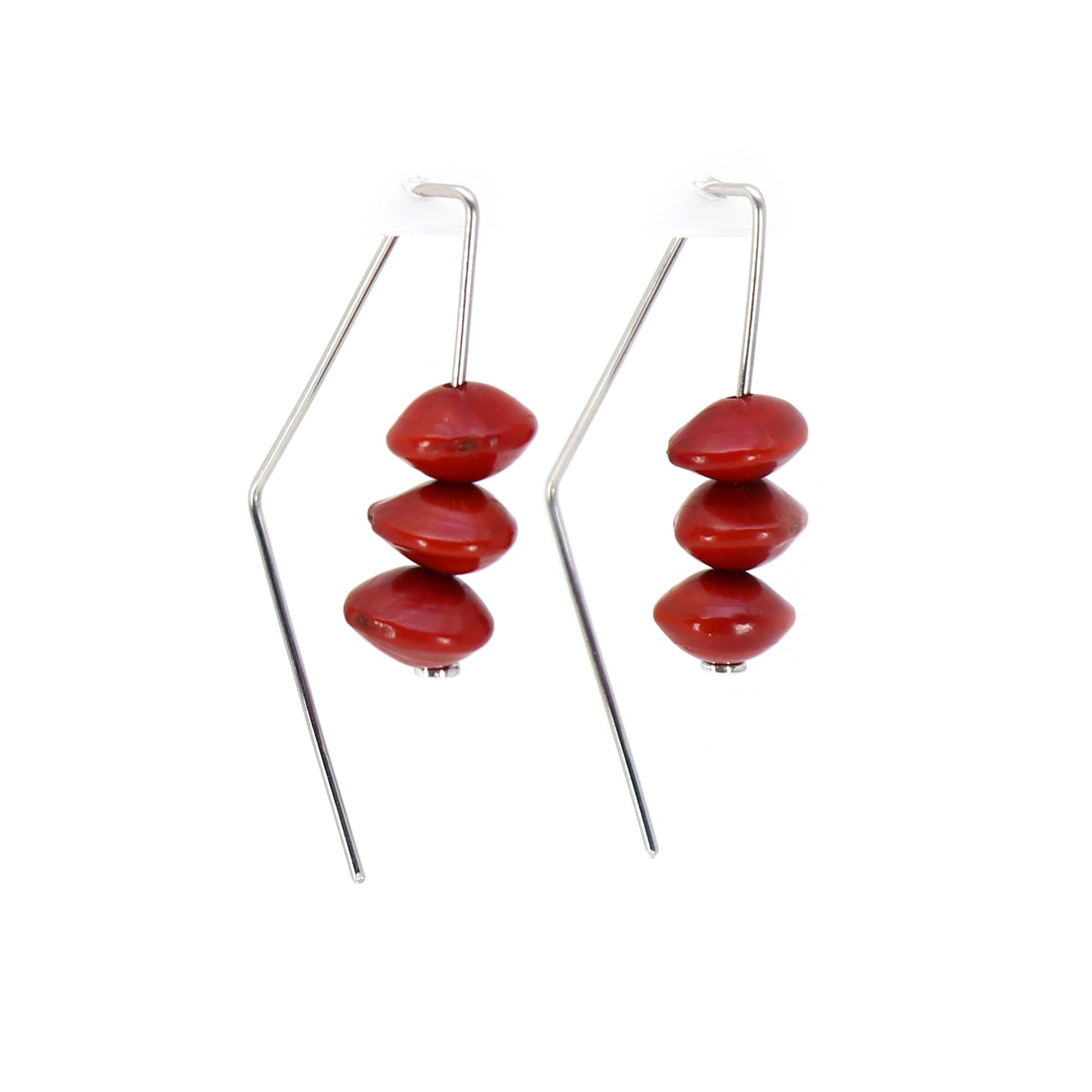 triangular wire earrings with 3 red saga beads on each with white background