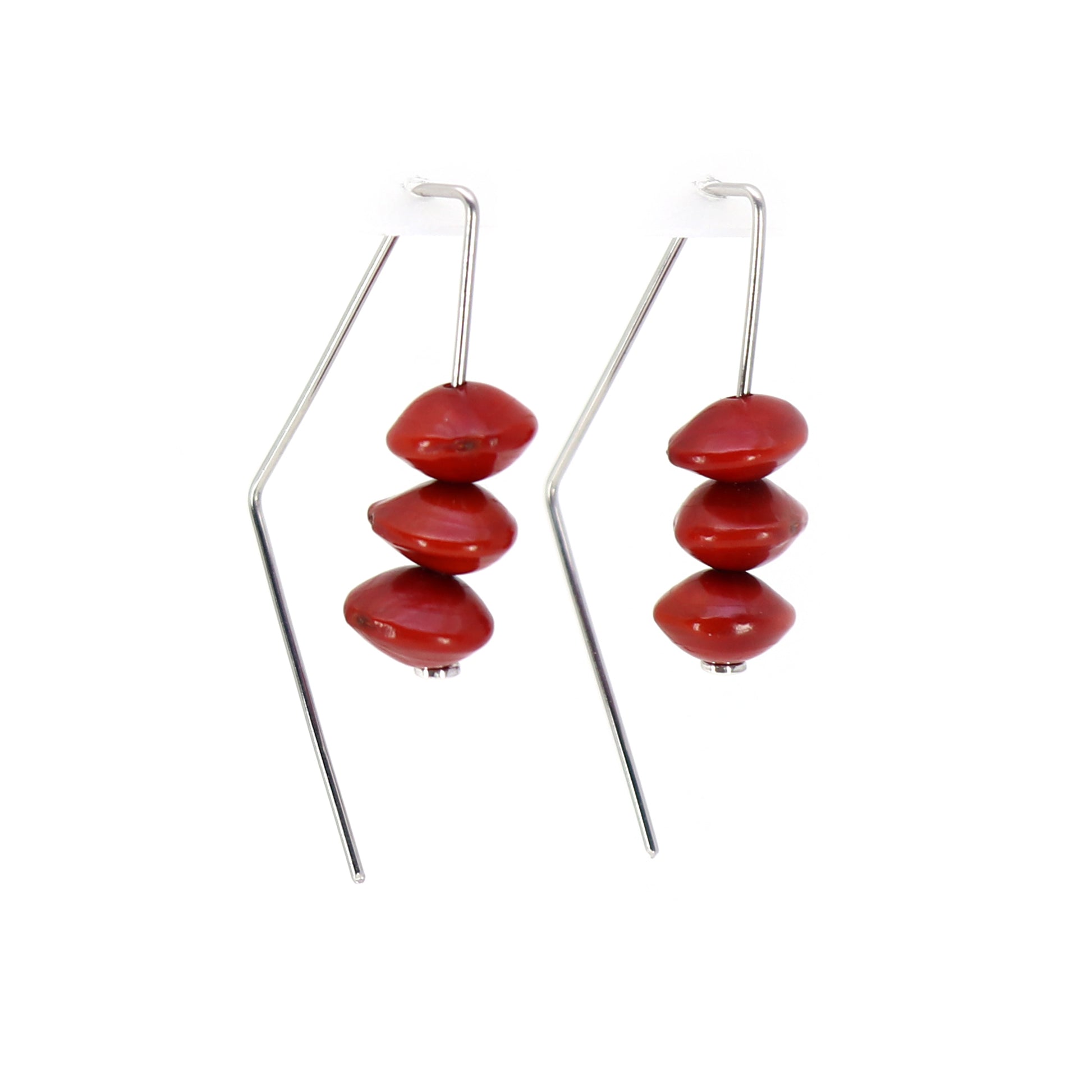 triangular wire earrings with 3 red saga beads on each with white background