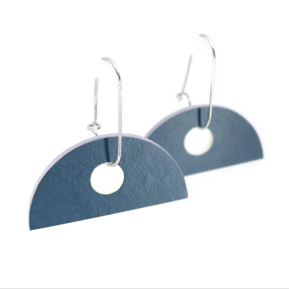 semi-circle navy earrings on oval hoops