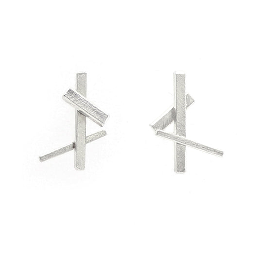 A pair of minimalist silver stud earrings featuring intersecting textured bar designs, shown against a plain white background.
