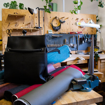 ditto bag on rolls of reclaimed fabric
