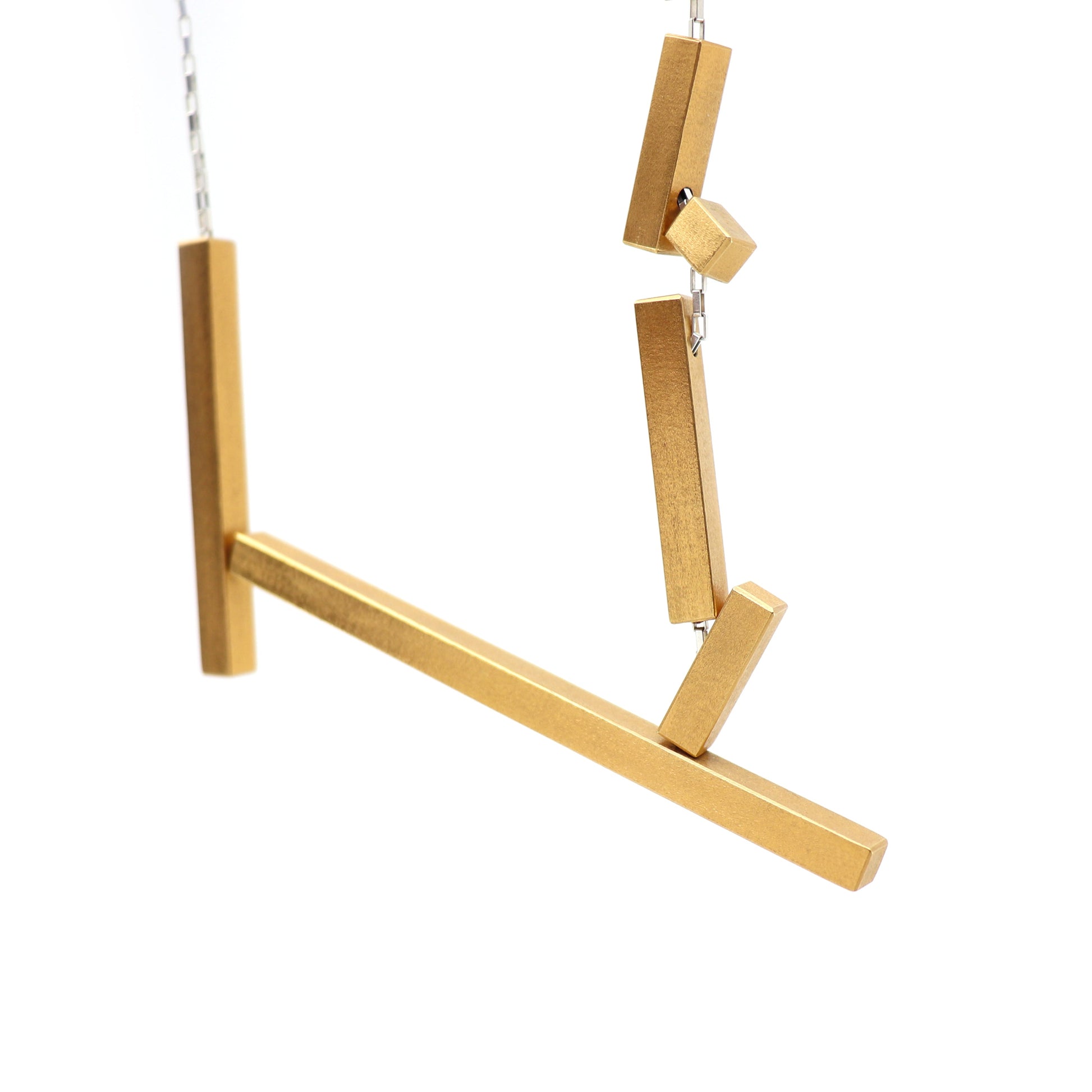 Gold rectangular components on silver chain