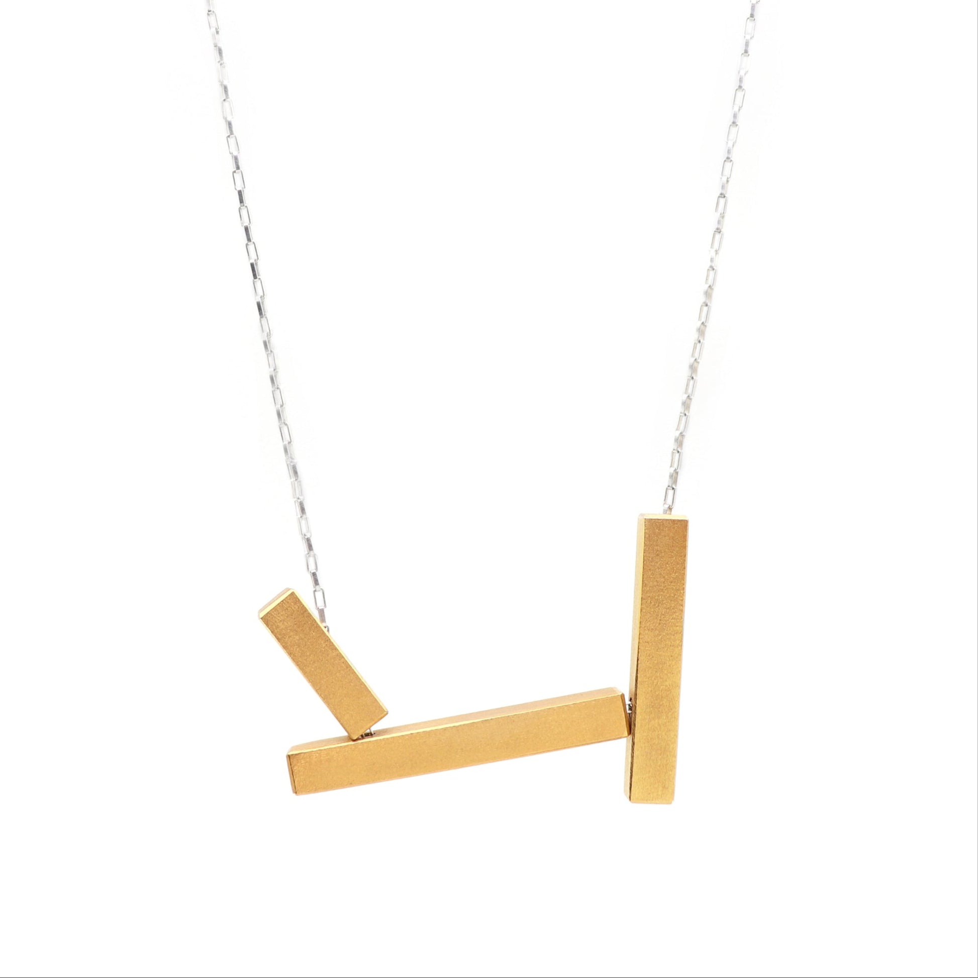 Gold necklace with three horizontal bars on a white background