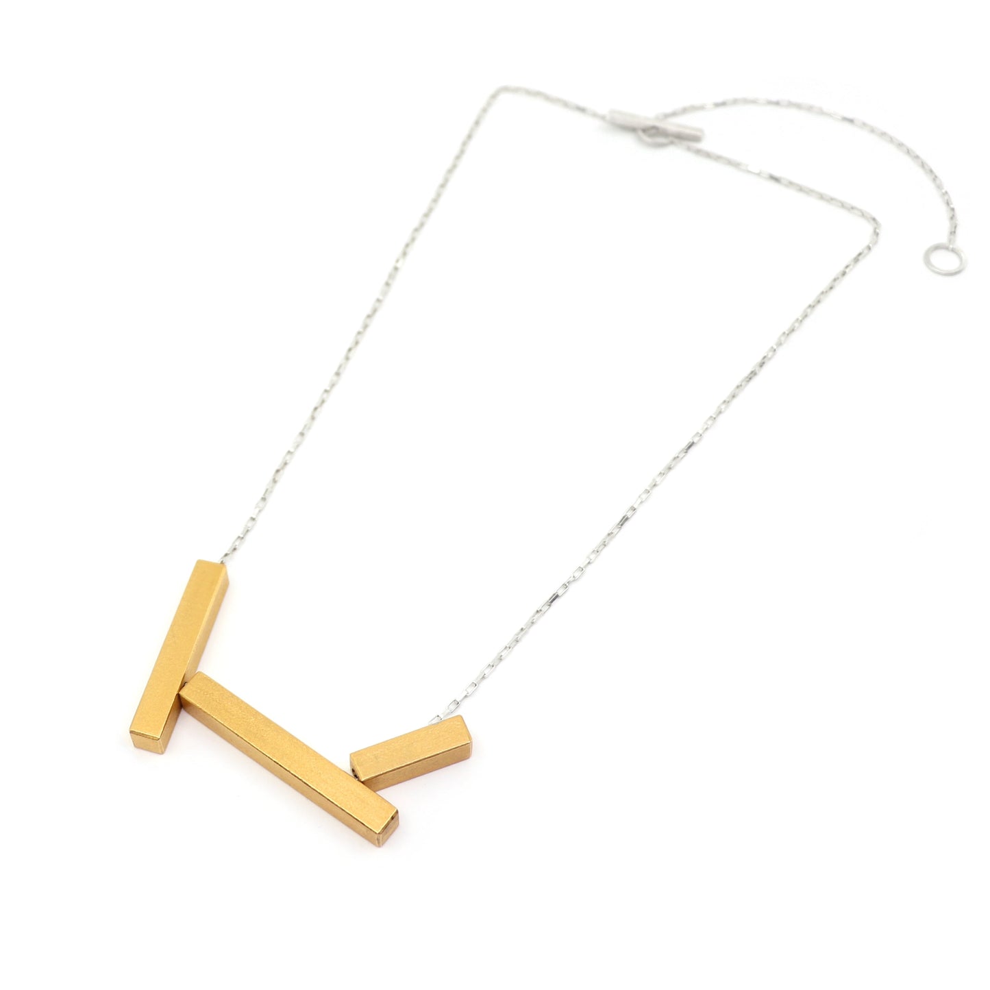 Gold necklace with three rectangular bars on a silver chain  on a white background