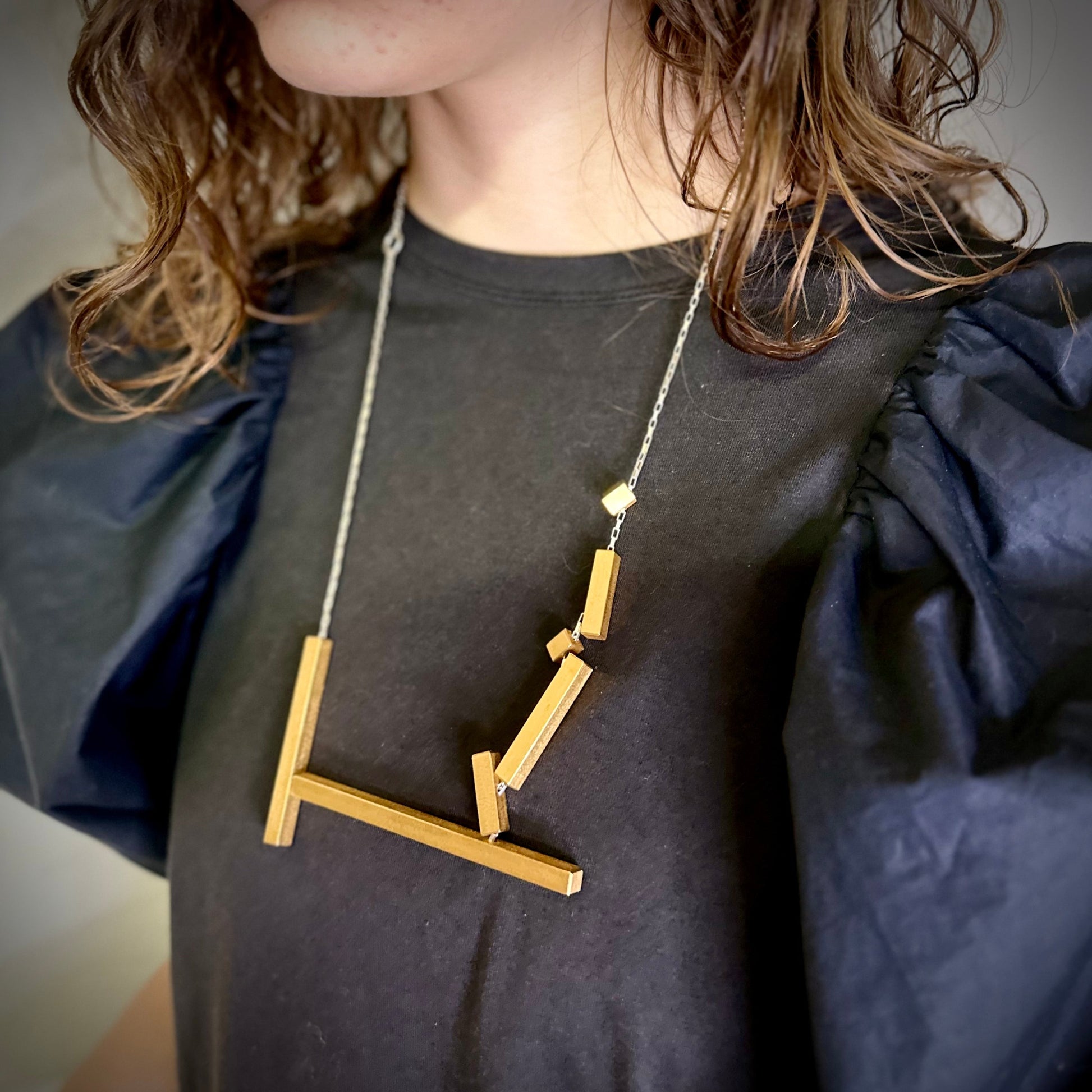Modelled landslide large statement necklace, adjustable chain worn long