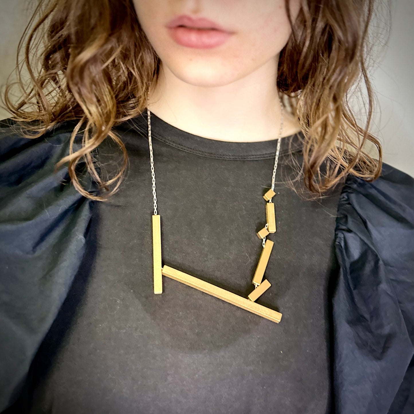 Modelled landslide gold and silver large statement necklace, adjustable chain worn mid length