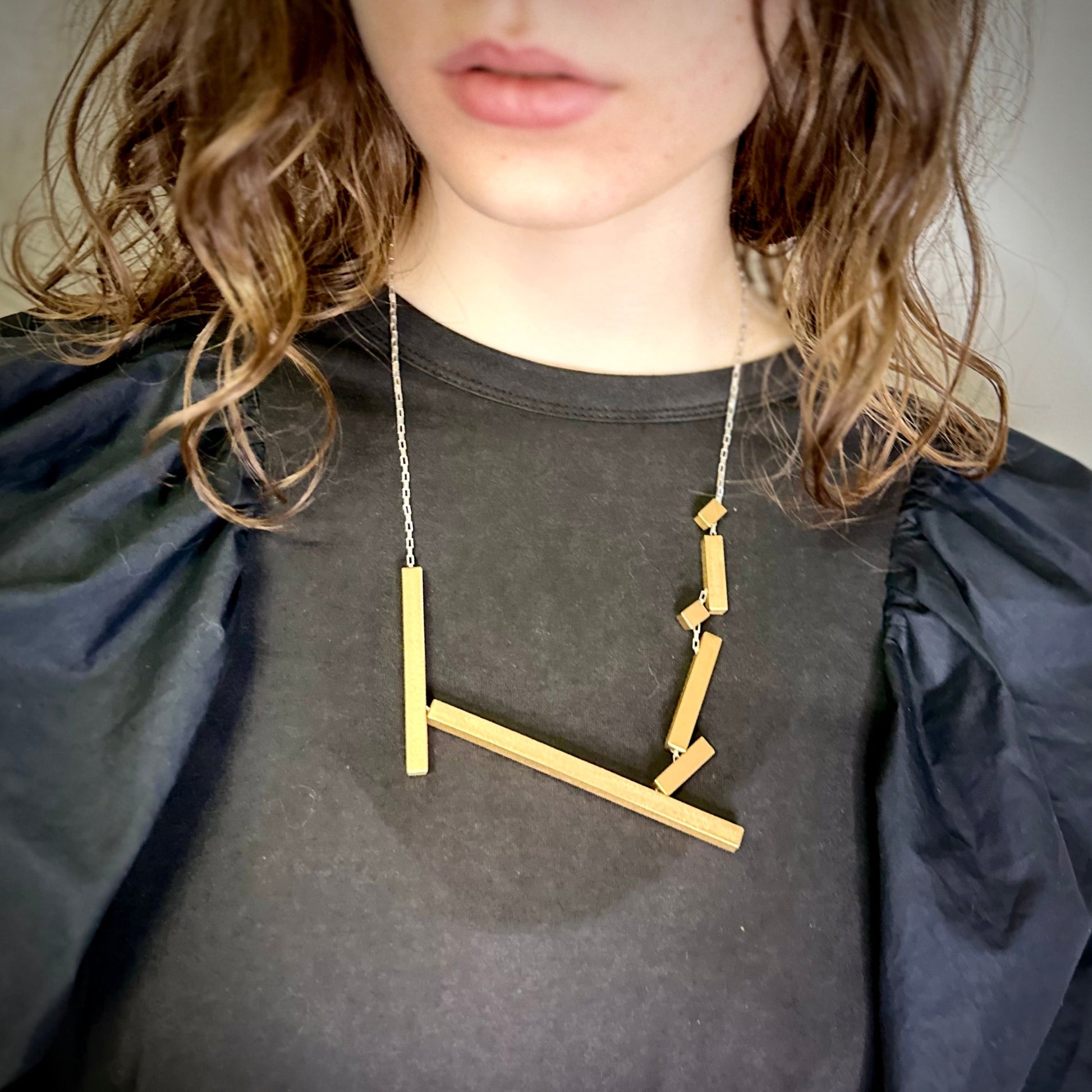 Modelled landslide gold and silver large statement necklace, adjustable chain worn mid length