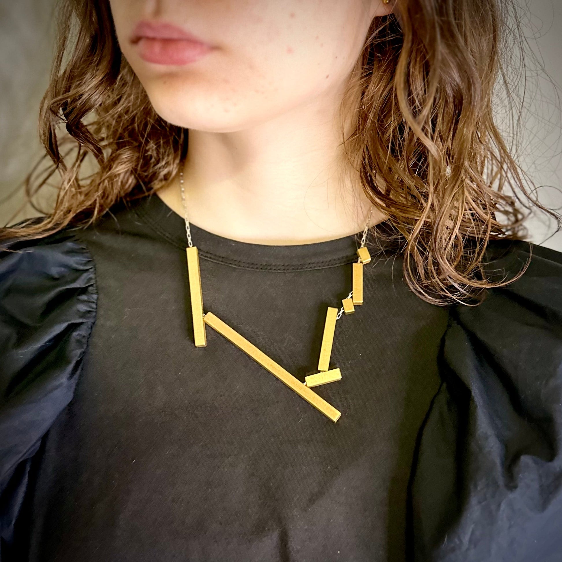 Modelled landslide gold and silver architectural large statement necklace, adjustable chain worn long