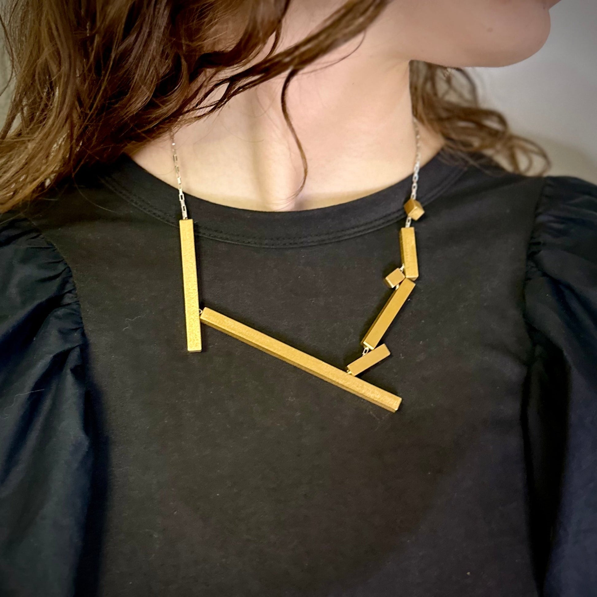 Architectural necklace in gold with an adjustable silver chain 