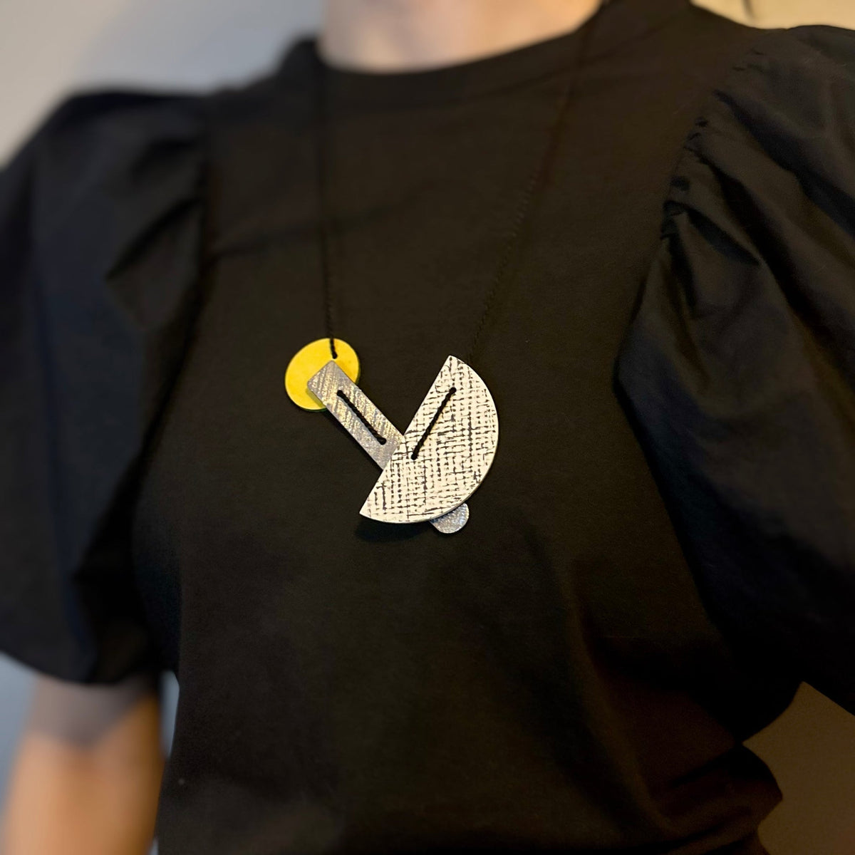 linoleum necklace in white and ello
