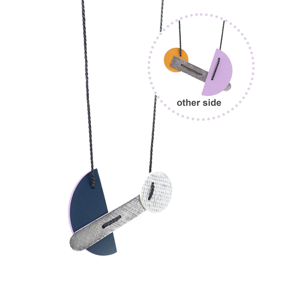 Necklace with geometric pendants on a white background
