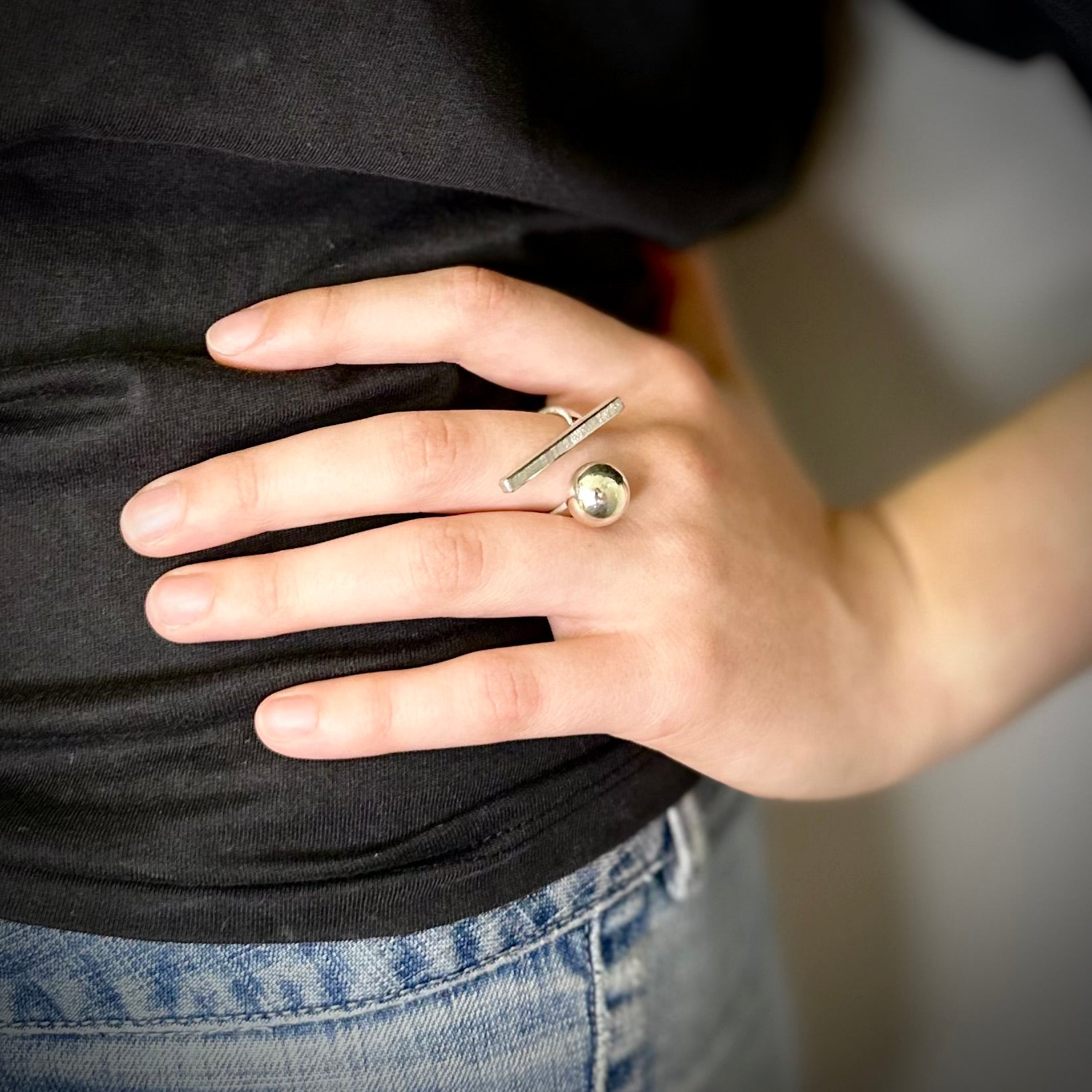 Statement cube stick ring hand on hip