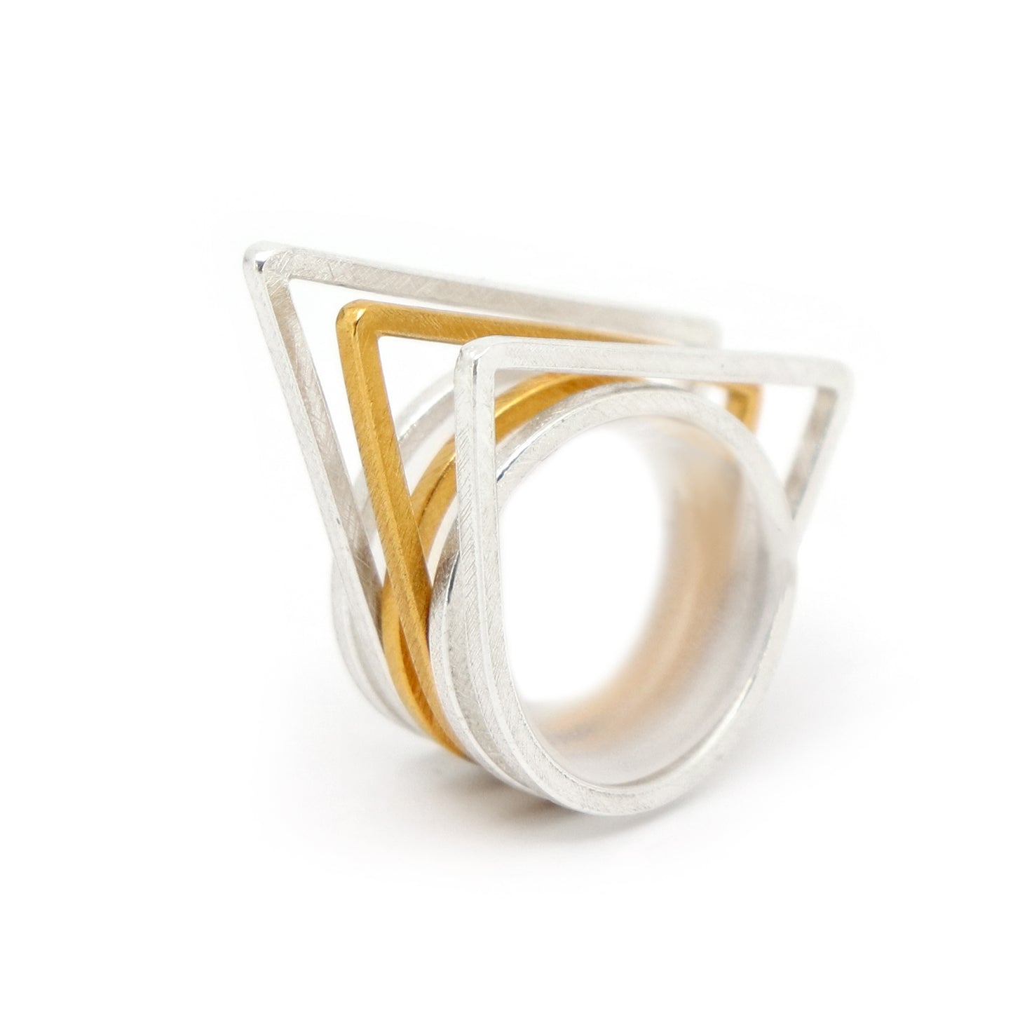 Geometric ring set with 1 gold and 2 silver geometric rings on a white background