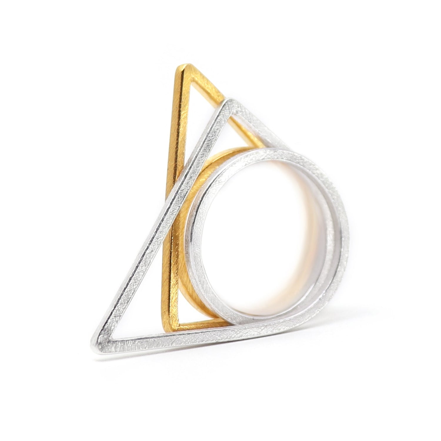 silver and gold stacking rings on a white background