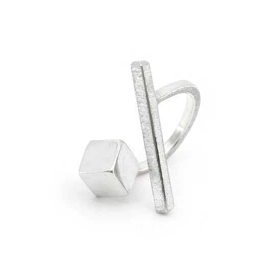Silver ring with geometric design on a white background