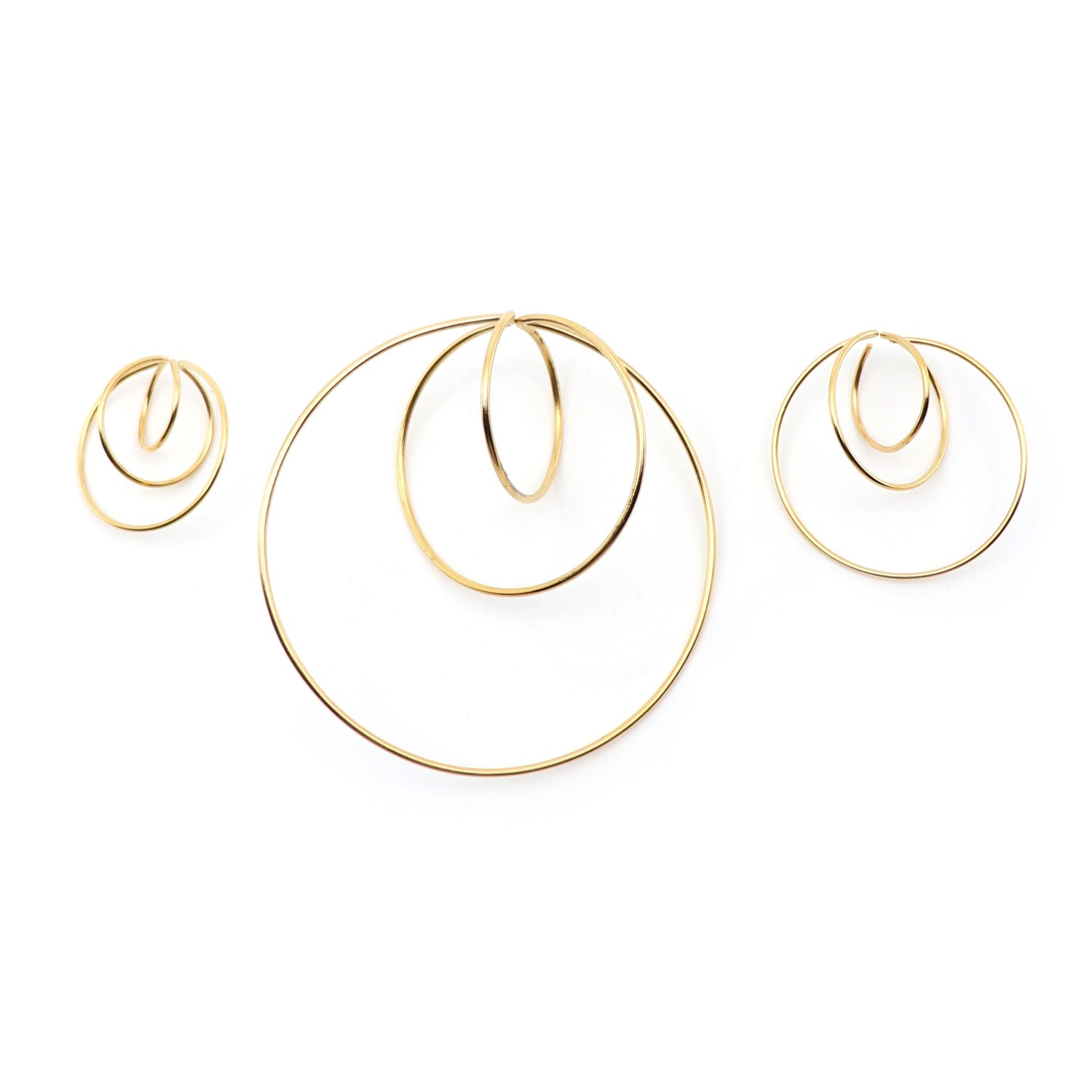 size comparison of 3 atomic earrings
