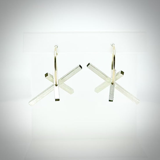 rotating architectural silver and gold hoop earrings