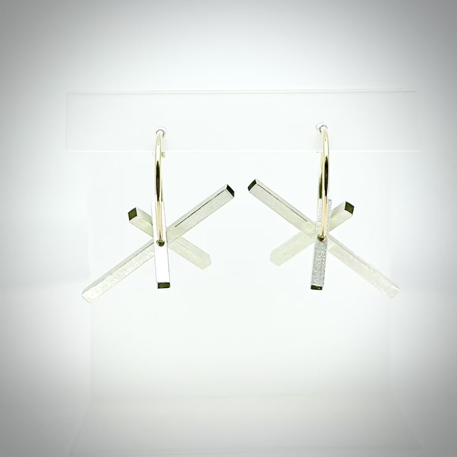 rotating architectural silver and gold hoop earrings