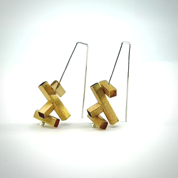 rotating gold and silver earrings