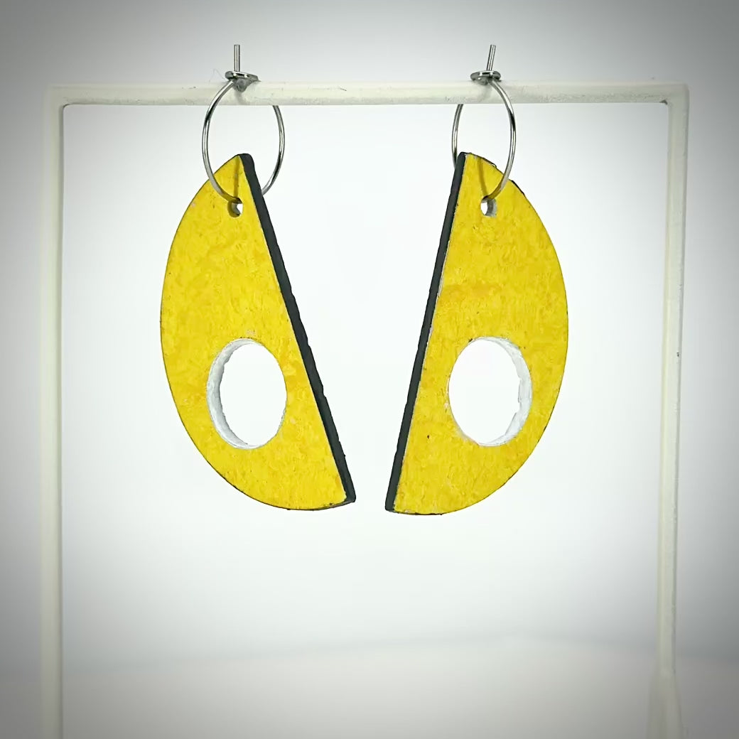 yellow semi-circle earrings rotating to show light grey back