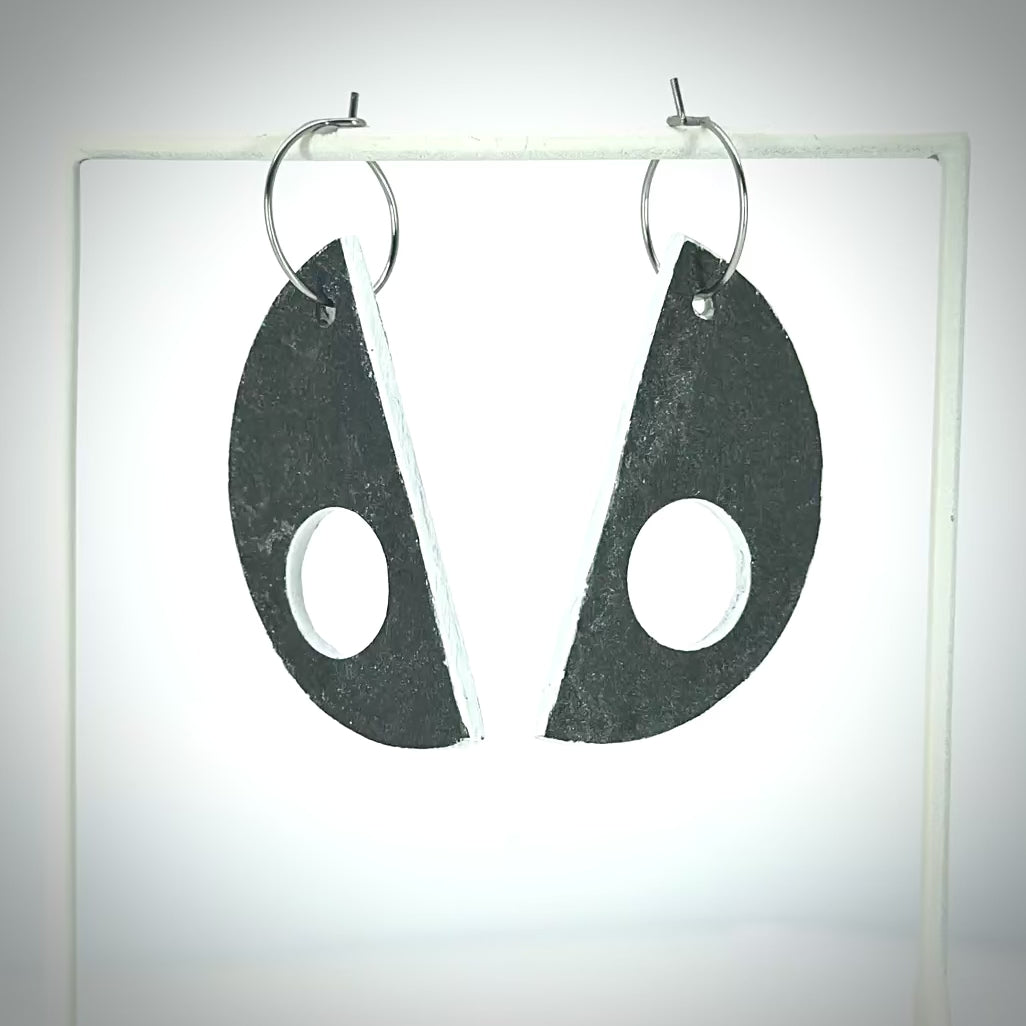 D shaped earrings with grey linoleum pendants on silver hoop rotating