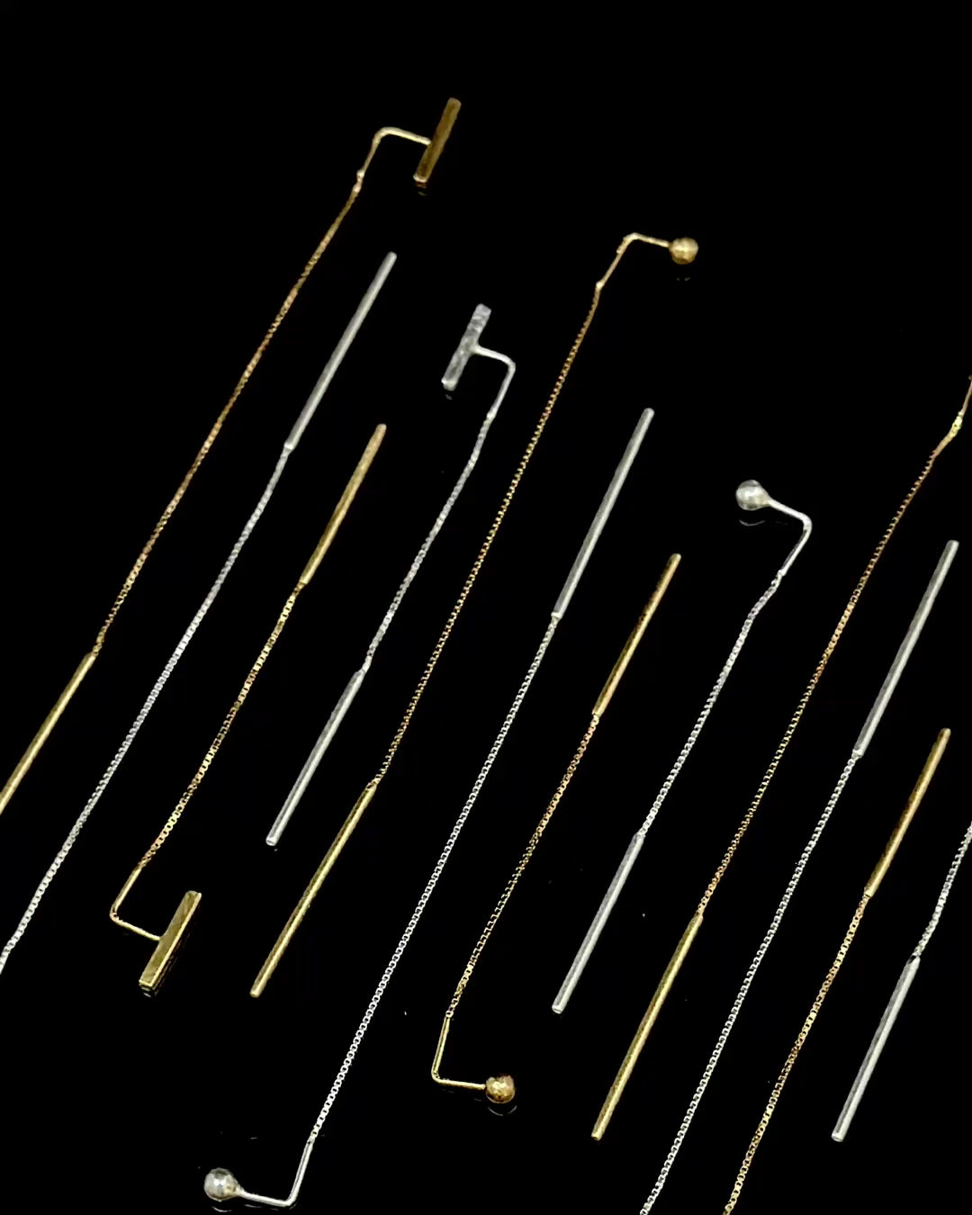 Spinning earlace earrings in sterling and gold